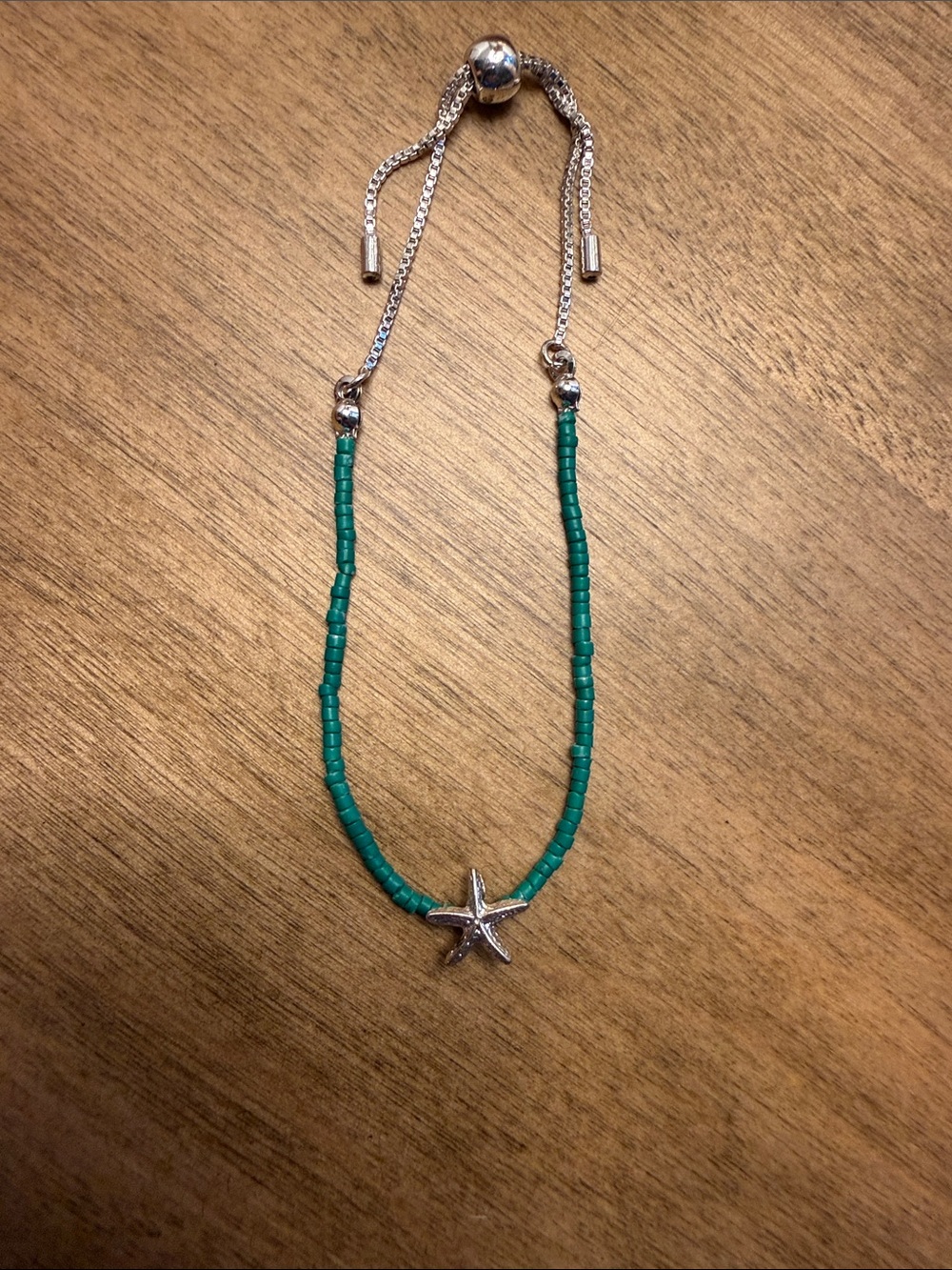 Silver Starfish Pendant Bracelet with Green Beads